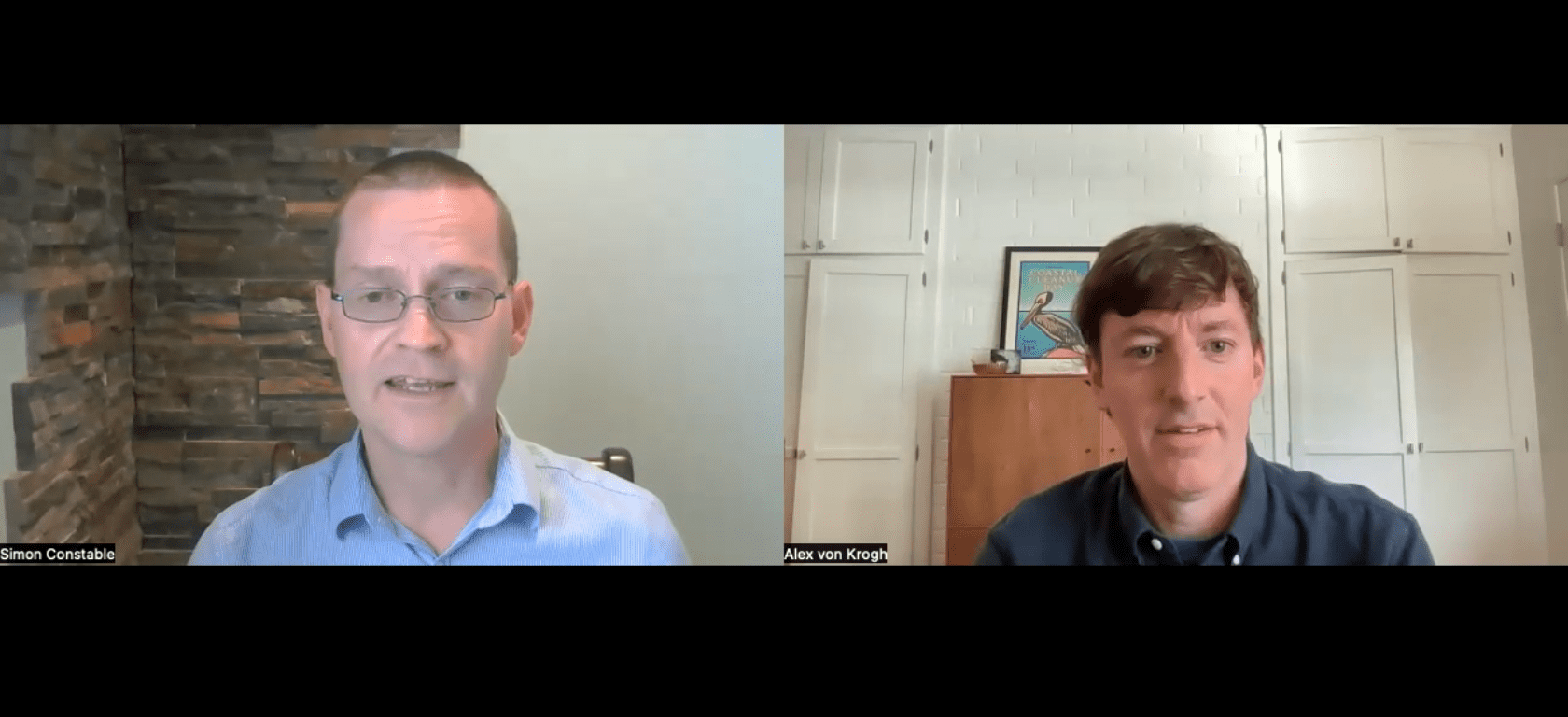 Professional video conference call featuring two men, Simon Constable and Alex von Krogh, participating in an interview or discussion from home offices with modern decor and framed artwork in the background.