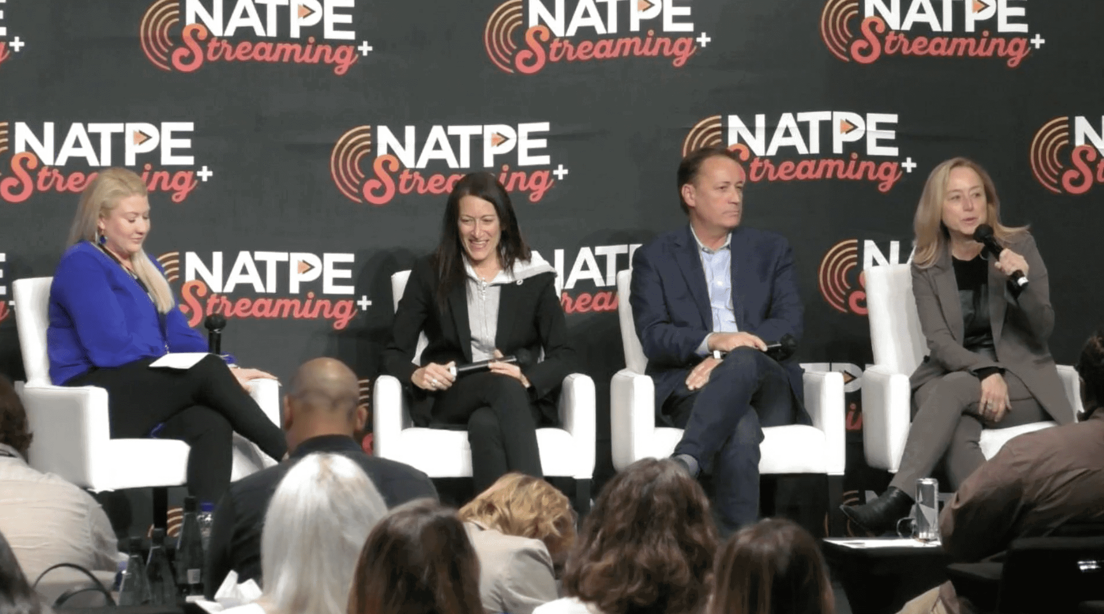 NATPE Streaming conference panel featuring diverse professionals discussing streaming industry trends and innovations on stage at NATPE event.