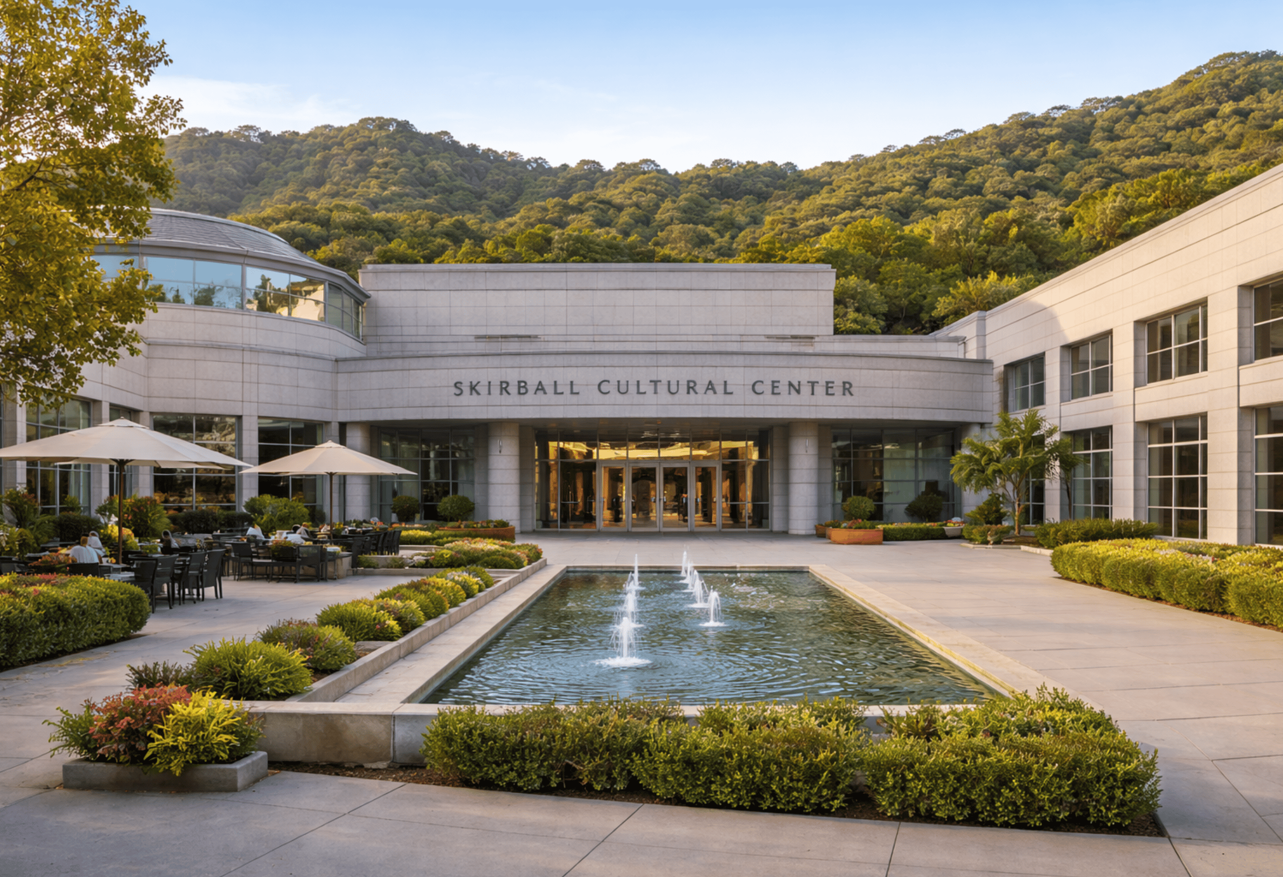 Elegant modern Skirball Cultural Center with outdoor garden, fountain, and mountain view, ideal for cultural events, exhibitions, and educational programs in Los Angeles, California.